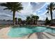 Backyard pool with lush tropical landscaping, rock accents, and ample space for relaxation and recreation at 4193 W Warm Springs Rd, Las Vegas, NV 89118