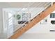 Staircase with white railing and a view into the living room at 4193 W Warm Springs Rd, Las Vegas, NV 89118