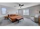Spacious bedroom with carpet floors, neutral walls, and a ceiling fan at 422 Barcarolle Ln, Henderson, NV 89011