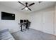 Bright bedroom with a ceiling fan, plush carpet, and a versatile layout, offering both comfort and functionality at 422 Barcarolle Ln, Henderson, NV 89011