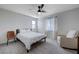 This is a well-lit bedroom with carpeted floors, a ceiling fan, and neutral décor, offering comfort and style at 422 Barcarolle Ln, Henderson, NV 89011