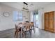Cozy dining area with modern table, chairs, and a sliding glass door at 422 Barcarolle Ln, Henderson, NV 89011