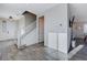 Bright entryway with a staircase, access to the living area, and a view of the modern kitchen at 422 Barcarolle Ln, Henderson, NV 89011