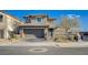Charming two-story home with a neutral color palette, manicured landscaping, and an attached two-car garage at 422 Barcarolle Ln, Henderson, NV 89011