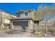 Attractive two-story home with a well-maintained front yard, a two-car garage, and a walkway to the entrance at 422 Barcarolle Ln, Henderson, NV 89011
