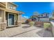 Well-kept front yard with a brick-paved patio leading to the front door of a charming home at 422 Barcarolle Ln, Henderson, NV 89011