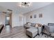 Upstairs living area with a plush gray couch, modern decor, and a functional workspace at 422 Barcarolle Ln, Henderson, NV 89011