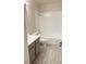 Clean bathroom with a shower/tub combo, gray vanity, and tile flooring at 5002 S Rainbow Blvd # 106, Las Vegas, NV 89118
