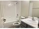 Updated bathroom with a shower/tub combo and gray vanity at 5002 S Rainbow Blvd # 106, Las Vegas, NV 89118