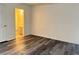 Bedroom with gray vinyl flooring and a view into the bathroom at 5002 S Rainbow Blvd # 106, Las Vegas, NV 89118