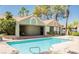 Community pool with lounge chairs and covered patio at 5002 S Rainbow Blvd # 106, Las Vegas, NV 89118