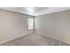 Cozy bedroom featuring neutral carpet and a window with a view at 555 E Silverado Ranch Blvd # 2086, Las Vegas, NV 89183