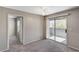 Bedroom features carpet floors, and a sliding glass door to the balcony at 555 E Silverado Ranch Blvd # 2086, Las Vegas, NV 89183