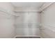 Spacious closet with multiple white metal shelves for optimal storage and organization at 555 E Silverado Ranch Blvd # 2086, Las Vegas, NV 89183