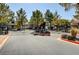 Gated community entrance featuring mature trees, landscaping, and secure access for residents at 555 E Silverado Ranch Blvd # 2086, Las Vegas, NV 89183