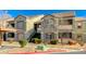 Exterior view of condo building with mature landscaping at 555 E Silverado Ranch Blvd # 2086, Las Vegas, NV 89183
