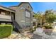 Exterior view of condo building with landscaped yard at 555 E Silverado Ranch Blvd # 2086, Las Vegas, NV 89183