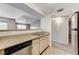 The kitchen features dual sinks and an open layout to the carpeted living room at 555 E Silverado Ranch Blvd # 2086, Las Vegas, NV 89183