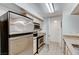 Efficient kitchen featuring stainless steel appliances, microwave, and tan countertops at 555 E Silverado Ranch Blvd # 2086, Las Vegas, NV 89183
