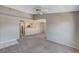 Open-concept living space connected to the kitchen with new carpet and high ceilings at 555 E Silverado Ranch Blvd # 2086, Las Vegas, NV 89183