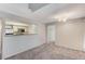 Open-concept living area featuring neutral tones, plush carpet, and great natural light at 555 E Silverado Ranch Blvd # 2086, Las Vegas, NV 89183