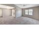 Bright living room features carpet floors, sliding glass door, and a ceiling fan at 555 E Silverado Ranch Blvd # 2086, Las Vegas, NV 89183