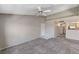 Open-concept living room features carpet floors, neutral paint and pass through to kitchen at 555 E Silverado Ranch Blvd # 2086, Las Vegas, NV 89183
