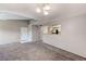 Open-concept living room features carpet floors, neutral paint and pass through to kitchen at 555 E Silverado Ranch Blvd # 2086, Las Vegas, NV 89183