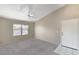 Bright living room with a ceiling fan and new carpet at 555 E Silverado Ranch Blvd # 2086, Las Vegas, NV 89183