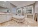 Elegant bathroom with a free-standing tub and double vanities at 61 Contrada Fiore Dr, Henderson, NV 89011