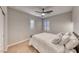 Comfortable bedroom with a queen bed and plantation shutters at 61 Contrada Fiore Dr, Henderson, NV 89011