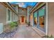 Private courtyard with stone pathway and French doors at 61 Contrada Fiore Dr, Henderson, NV 89011