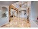 Two-story entry with stone wall and staircase at 61 Contrada Fiore Dr, Henderson, NV 89011