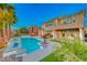 Two-story home with pool and landscaped yard at 61 Contrada Fiore Dr, Henderson, NV 89011