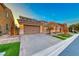Beautiful home with a large driveway and manicured lawn at 61 Contrada Fiore Dr, Henderson, NV 89011