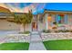 Inviting front entry with stonework and landscaping at 61 Contrada Fiore Dr, Henderson, NV 89011
