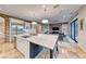 Open kitchen with large island and views to living room at 61 Contrada Fiore Dr, Henderson, NV 89011