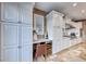 White kitchen with built-in wine storage at 61 Contrada Fiore Dr, Henderson, NV 89011