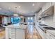 Spacious kitchen with island, stainless steel appliances, and white cabinetry at 61 Contrada Fiore Dr, Henderson, NV 89011