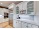 Kitchen features stainless steel appliances and white cabinetry at 61 Contrada Fiore Dr, Henderson, NV 89011