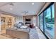 Spacious living area with a fireplace and access to the backyard at 61 Contrada Fiore Dr, Henderson, NV 89011