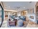 Open living room with fireplace and herringbone flooring at 61 Contrada Fiore Dr, Henderson, NV 89011