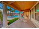 Relaxing backyard oasis with a pool, patio, and seating area at 61 Contrada Fiore Dr, Henderson, NV 89011