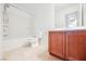 Bathroom features a bathtub, toilet, and vanity at 7332 Marble Lake St # 103, Las Vegas, NV 89149