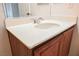 Bathroom vanity with wood cabinets and sink at 7332 Marble Lake St # 103, Las Vegas, NV 89149
