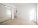 Bright bedroom with mirrored closet and carpet at 7332 Marble Lake St # 103, Las Vegas, NV 89149