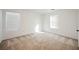 Well-lit bedroom featuring neutral carpeting at 7332 Marble Lake St # 103, Las Vegas, NV 89149