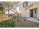 Front entry of townhome with landscaping and walkway at 7332 Marble Lake St # 103, Las Vegas, NV 89149
