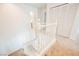 Upstairs hallway with white railing and carpet flooring at 7332 Marble Lake St # 103, Las Vegas, NV 89149