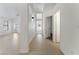 Bright hallway featuring tiled floors, white walls, and easy access to other rooms at 852 Rainbow Rock St, Las Vegas, NV 89123